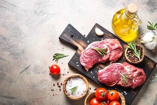 Fresh beef steak with herbs top view. — Stock Photo, Image