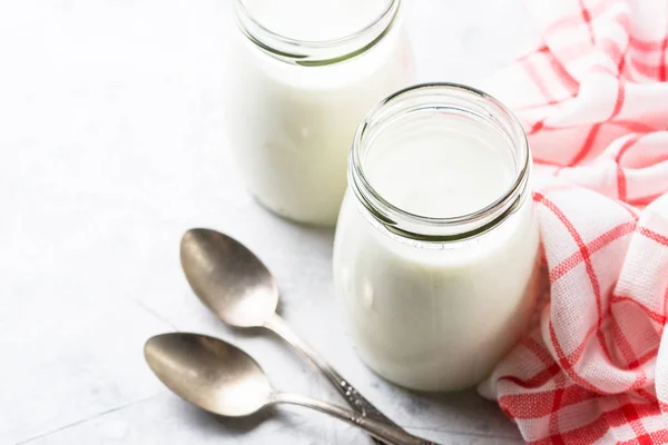 Greek yogurt in glass jars. — Stock Photo, Image