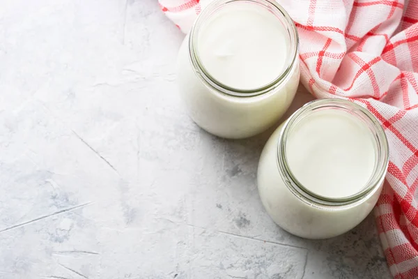 Greek yogurt in glass jars. — Stock Photo, Image