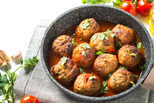 Meatballs in tomato sauce in a frying pan. — Stock Photo, Image