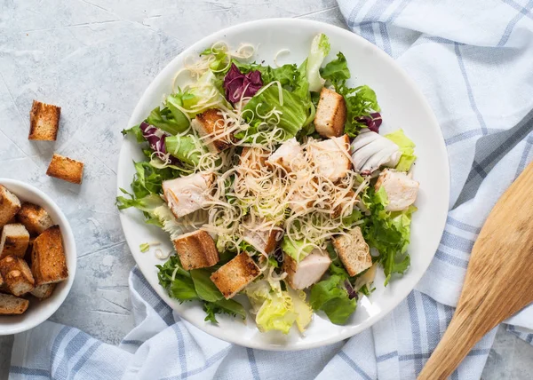 Caesar salad in white plate — Stock Photo, Image