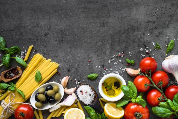 Italian Food background on black stone table. Top view.