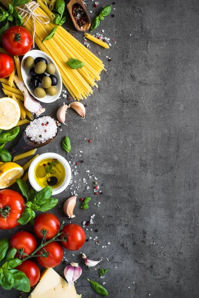 Italian Food background on black stone table. Top view.