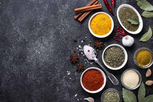 Set of Various spices and herbs on black stone table. — Stock Photo, Image