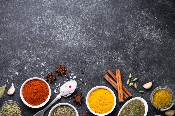 Set of Various spices and herbs on black stone table. — Stock Photo, Image