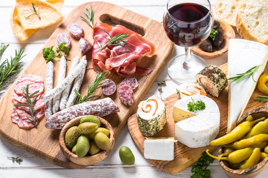 Antipasto delicatessen - meat, cheese and wine.