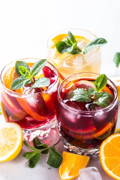 White, pink and red sangria with fruit, ice and mint. — Stock Photo, Image