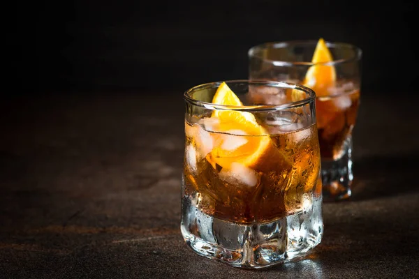 Negroni cocktail in glass on dark. — Stock Photo, Image