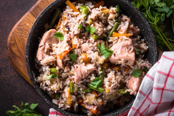 Pilaf with turkey meat and brown rice.