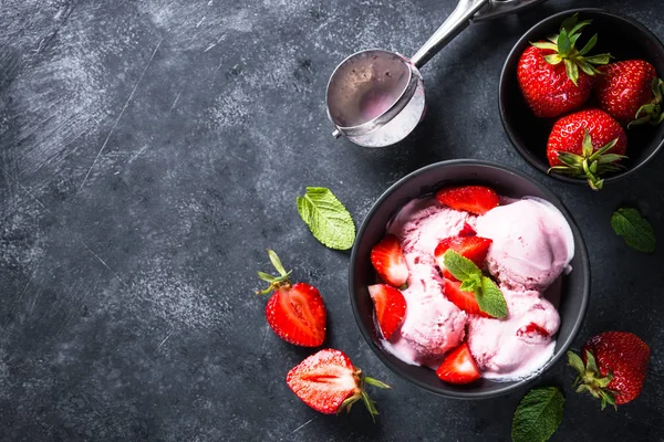 Strawberry ice cream on black. Top view. — Stock Photo, Image