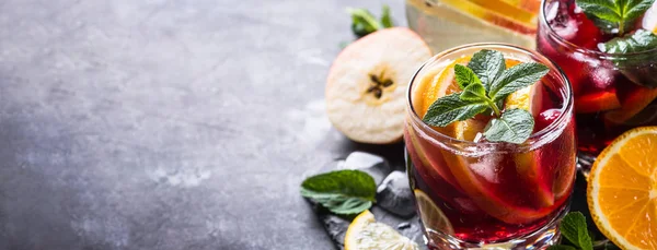 Sangria with fruit, ice and mint in glass. — Stock Photo, Image