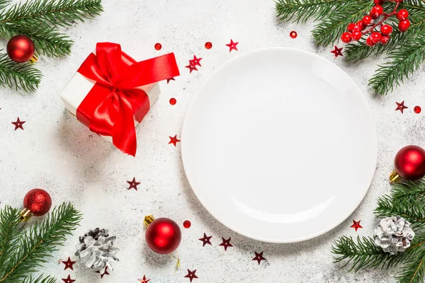 Christmas table setting on white top view.