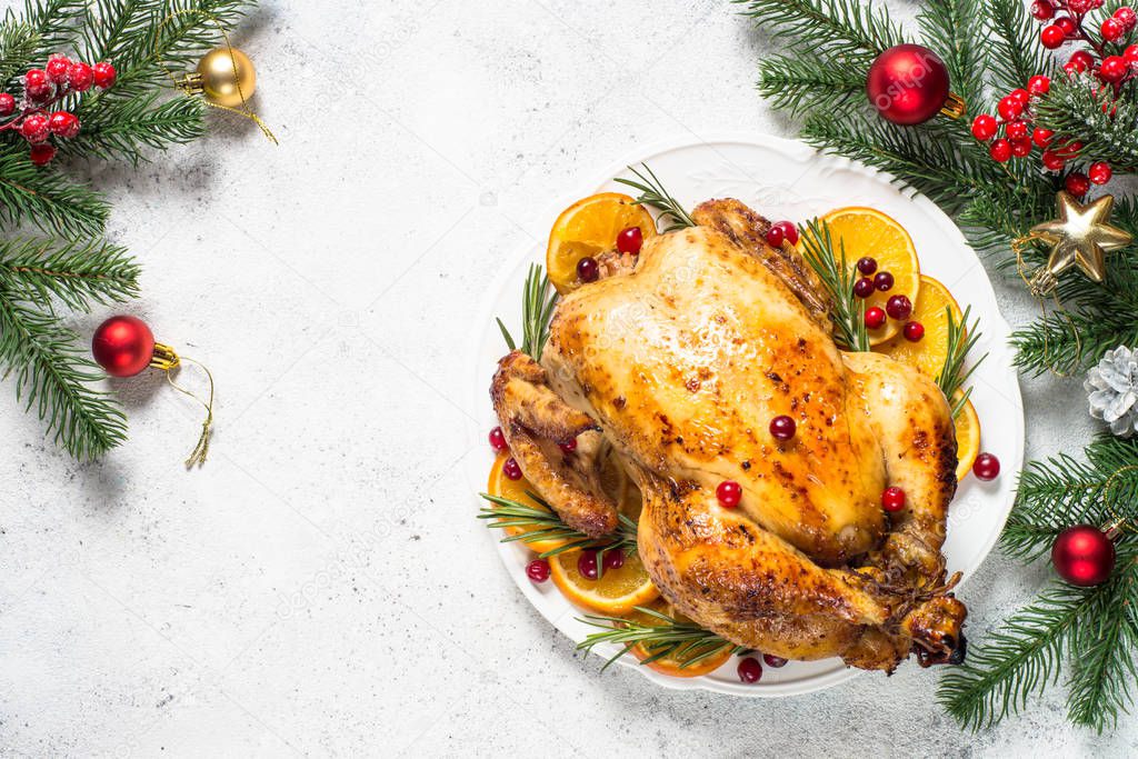 Chrismas chicken baked with cranberry, orange and rosemary. Christmas food.