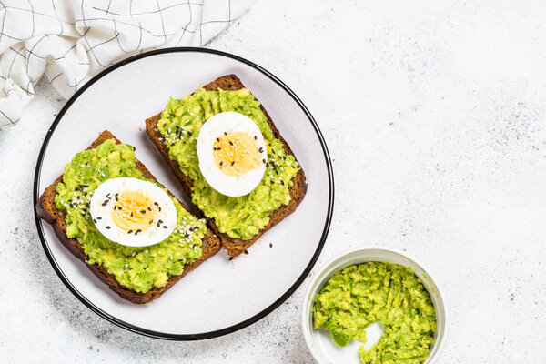 Avocado Sandwiches on white background.