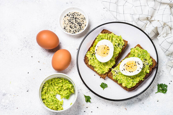 Avocado Sandwiches on white background.
