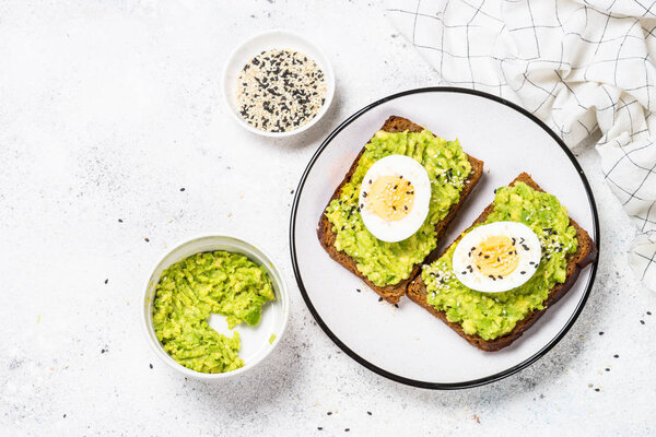 Avocado Sandwiches on white background.
