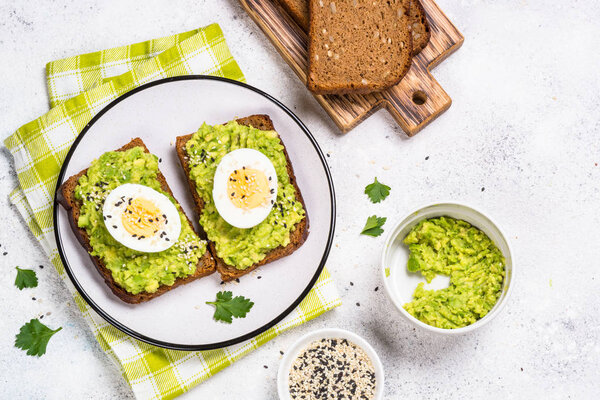 Avocado Sandwiches on white background.