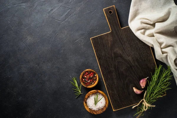 Food cooking background with herbs and spices on black. — Stock Photo, Image