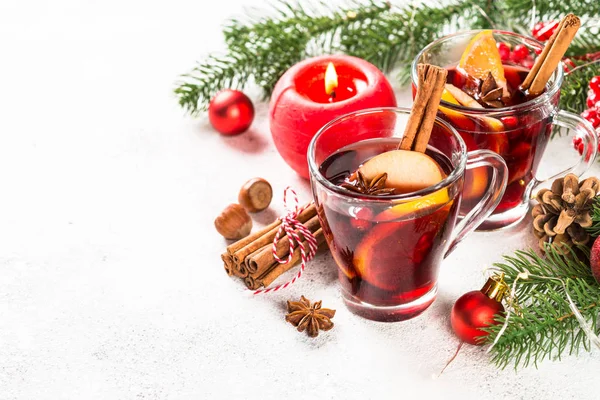 Mulled wine with christmas decorations on white. — Stock Photo, Image