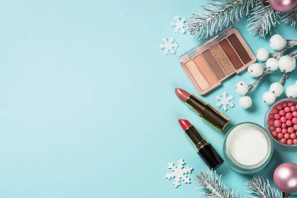 Makeup products, skincare product with christmas decorations.
