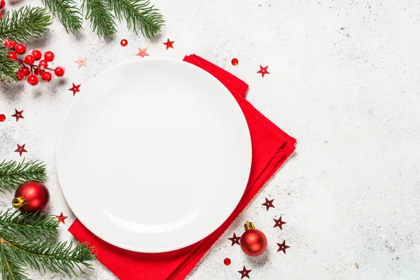 Christmas table setting on white top view.