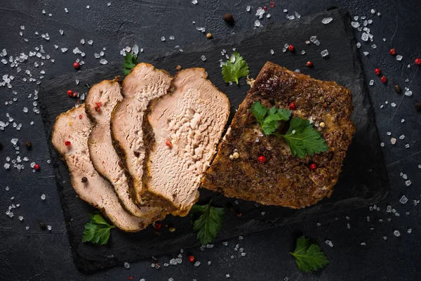 Baked pork meat ham on black kitchen table. — 스톡 사진