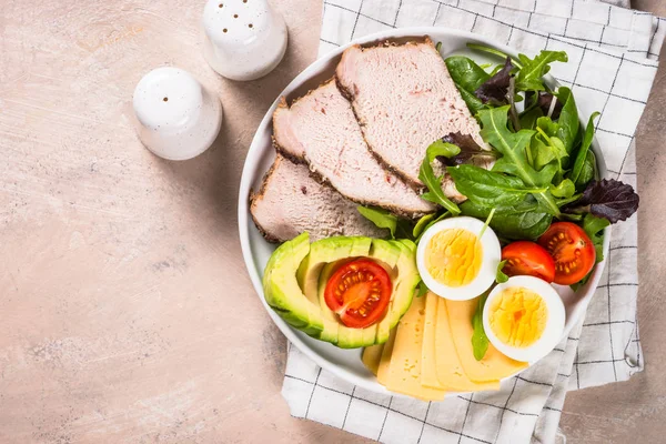 Keto diet plate on white table.