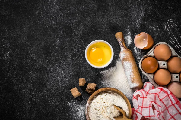 Ingredients for cooking baking on black. — Stock Photo, Image