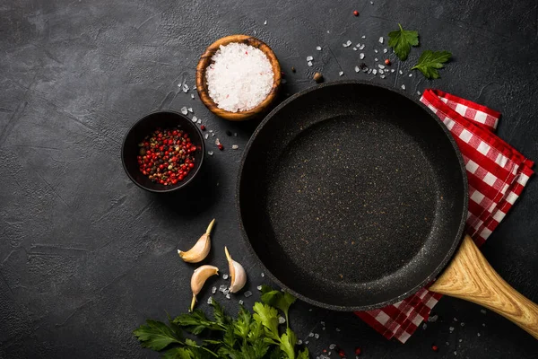 Frying pan or skillet on black table. — Stock Photo, Image