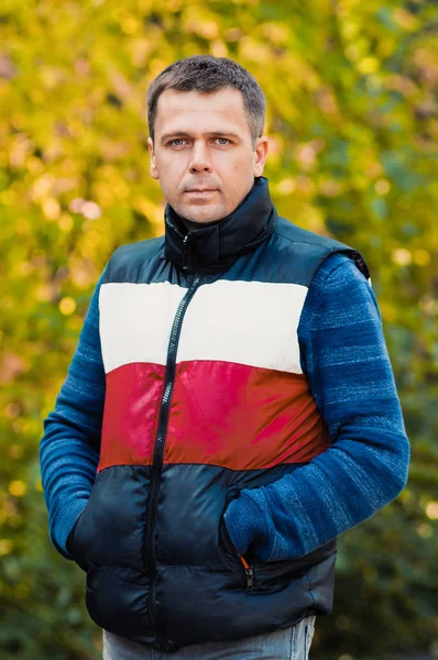 Portrait of handsome man in autumn park Stock Image