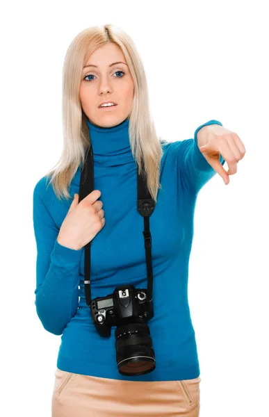 Beauty woman holding a camera and pointing — Stock Photo, Image