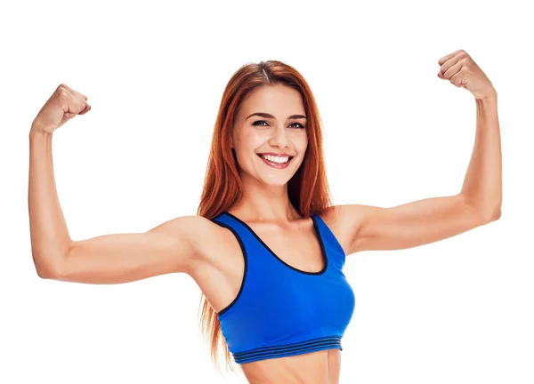 Nő mosolygó fitness portré. bicepsz mutatja a kéz — Stock Fotó