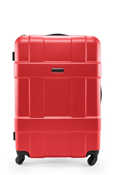 Красный чемодан пластик — стоковое фото