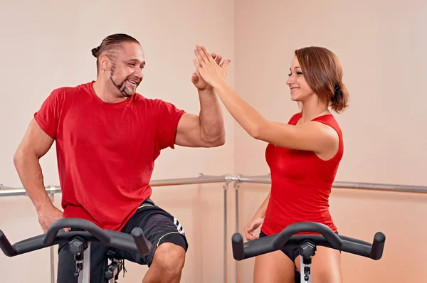 Indoor bycicle cycling handshake — Stock Photo, Image