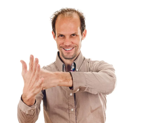 Exited young man kicks clenched fist arm — Stock Photo, Image