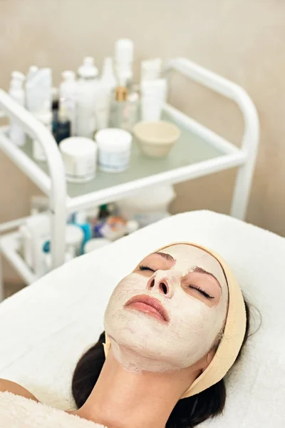 Woman with facial mask — Stock Photo, Image