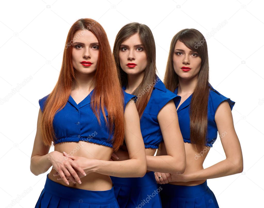 three long-haired women portrait. triplets sisters