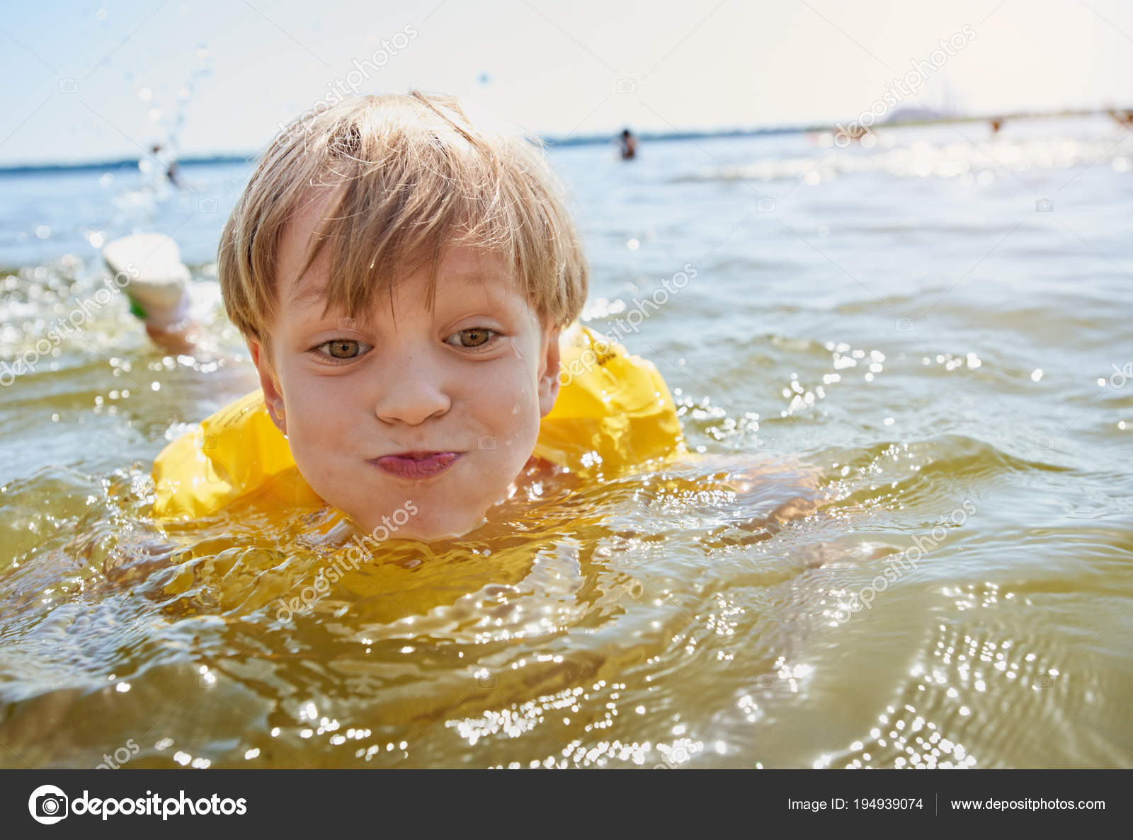 Little boy swimming Stock Photo by ©seenaad 194939074