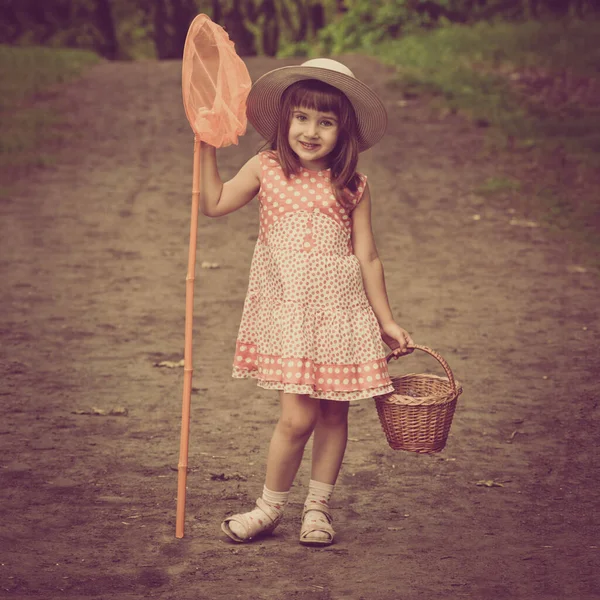 Girl with butterfly net — Stock Photo, Image