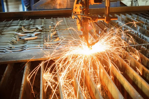 Oxygen torch cuts steel sheet.