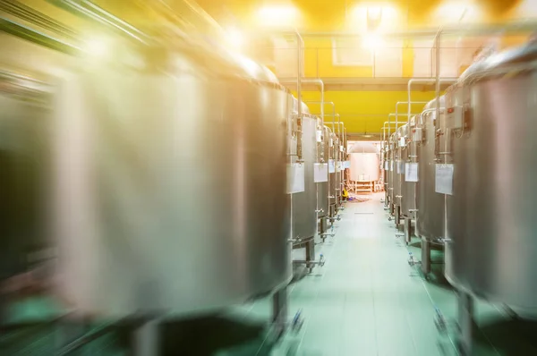 Modern Beer Factory. Rows of steel tanks for the storage beer.