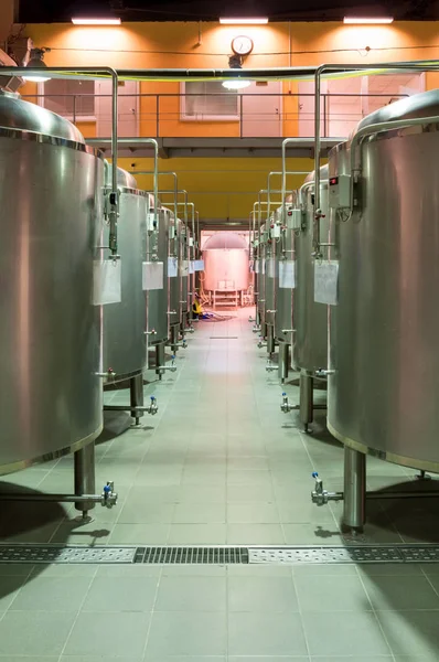 Modern Beer Factory. Rows of steel tanks for the storage beer.