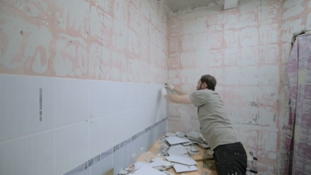Dismantling ceramic tiles with a chisel and a hammer. — Stock Video ... Dismantling ceramic tiles with a chisel and a hammer. — Stock Video ...