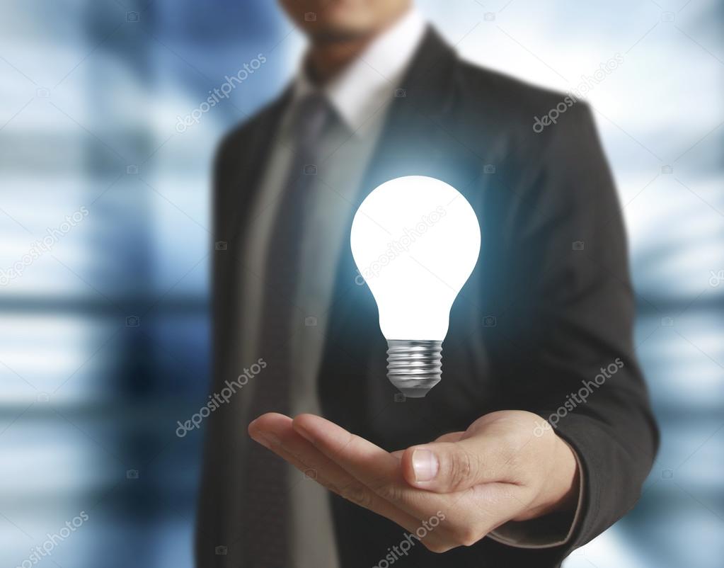 Hands holding light bulb 