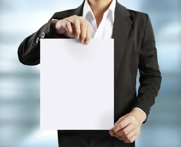 Blank sheet of paper in  hand — Stock Photo, Image