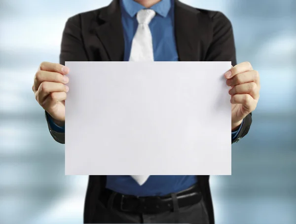 Blank sheet of paper in  hand — Stock Photo, Image