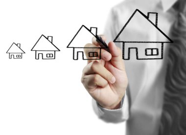 İşadamı el bir ev çizimi 