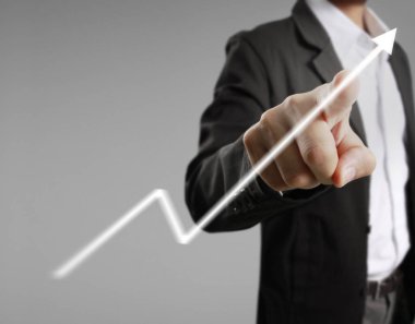 Finansal sembolleri olan bir iş adamı geliyor.
