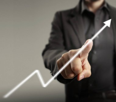 Finansal sembolleri olan bir iş adamı geliyor.