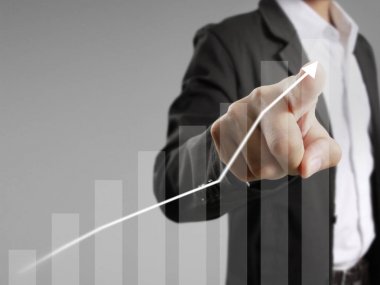 Finansal sembolleri olan bir iş adamı geliyor.